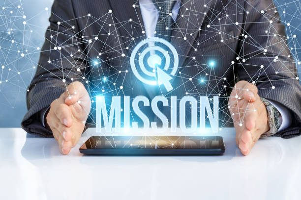 Businessman shows the word mission on the virtual screen. Businessman shows the word mission on the virtual screen.